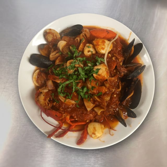 Zuppe Di Pesce Over Linguine.